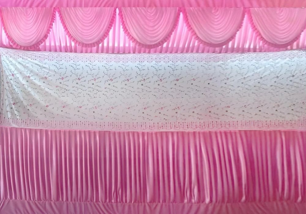 Pink and white embroidered stage backdrop