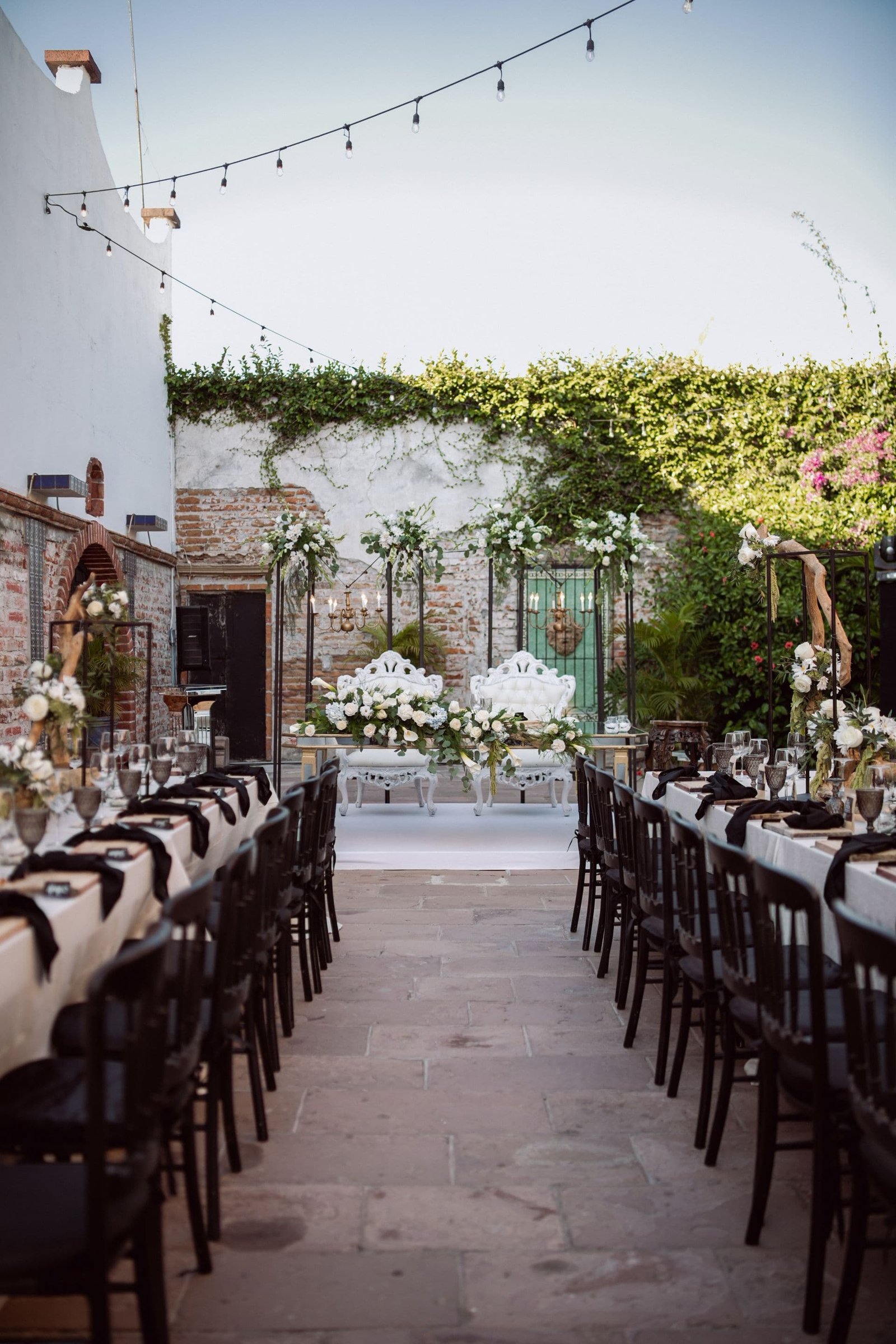 Elegant outdoor wedding reception styled with string lights